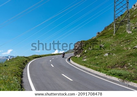 Similar – Image, Stock Photo Winding road on hilly terrain