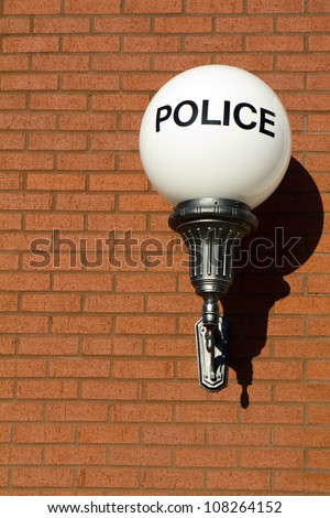 Old Fashioned Vintage Police Sign On A Globe Light Hangs On A Brick ...