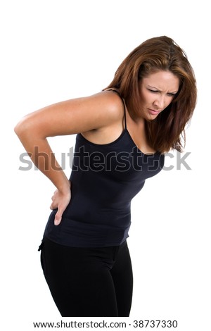 Woman bends over and flinches in pain in her back.