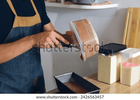 Similar – Foto Bild Nicht erkennbarer Koch legt Teig in Tasse