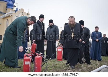 April 4, 2015. Kiev, Ukraine. Firefighters trained priests to extinguish fire in an emergency situation. This training is conducted every year before the Easter holidays.