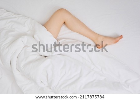 Similar – Image, Stock Photo lying woman with bent legs