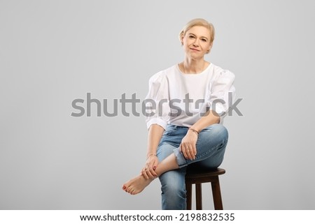 Similar – Image, Stock Photo Legs of woman sitting in sea water