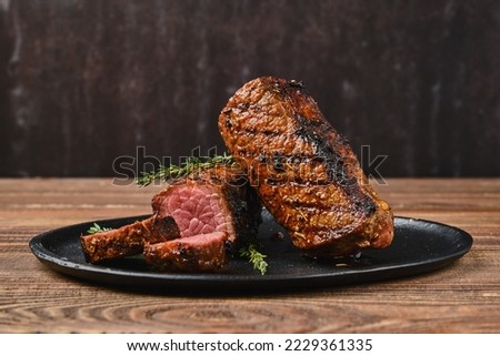 Similar – Image, Stock Photo Roast beef on a roll with onions, parsley and horseradish