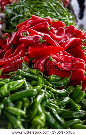 Red Salçalik and Green Aci Sivri Peppers for sale at a farmer's market Stok fotoğraf © 