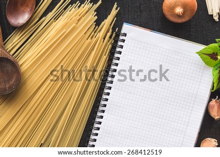 Italian spaghetti photo recipe. Food mockup. Homemade pasta illustrated recipe. Stationary mockup. Notebook and pen on the kitchen table surrounded with a products.