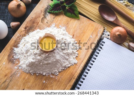 Italian spaghetti photo recipe. Food mockup. Homemade pasta illustrated recipe. Stationary mockup. Notebook and pen on the kitchen table surrounded with a products.