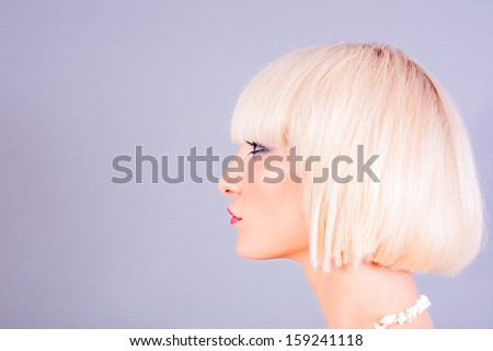 profile portrait of young blond woman