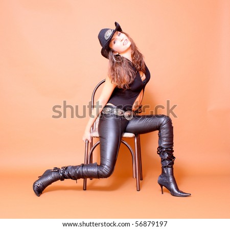 Cowboy girl wearing leather pants