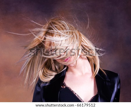 Blond girl with fluttering hair