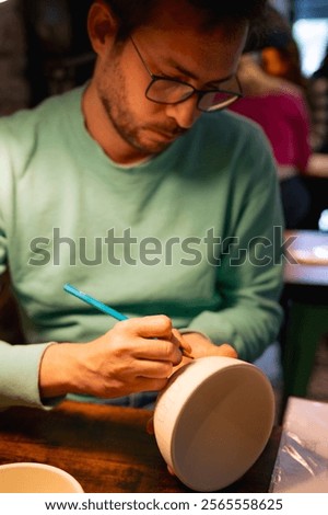 Similar – Image, Stock Photo Craftswoman painting a bowl made of clay in art studio