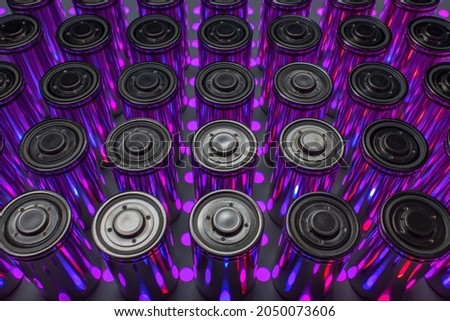 A pack of new modern high-capacity lithium-ion cells. A prototype of new batteries on a laboratory table with UV light. Stok fotoğraf © 