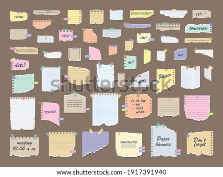 Paper notes on stickers. Sticky note paper posts of meeting reminder, to do list and office notice or information board notes. Torn sheets of notebook, multi colored sheets and pieces of torn paper.