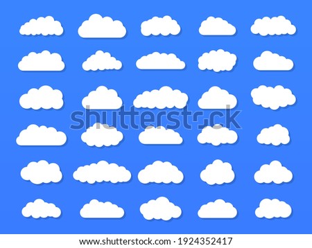Set of vector cartoon clouds on a blue background. Set of sky.