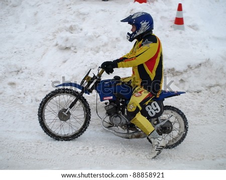 RIGA, LATVIA - JANUARY 7: Unidentified motocross moped rider at Winter motocross championship, Jan 7, 2011 at \