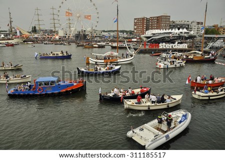 Port Amsterdam, Amsterdam, the Netherlands - August 21, 2015: View of the busy Ijhaven port at the time of the SAIL 2015 (www.sail.nl), an international public nautical event held every 5 years.