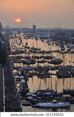 Port Amsterdam, Amsterdam, the Netherlands - August 19, 2015: The Ijhaven port on the 1st day of the SAIL (www.sail.nl), an international public nautical event held once in every 5 years since 1975.