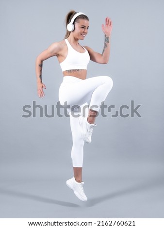 Similar – Image, Stock Photo Woman with headphones before working out in park