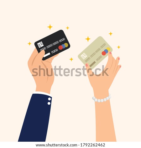 Hands show credit card and debit card for payment.