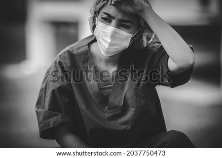 Similar – Image, Stock Photo hard working female doctor, heath care worker with face shield and mask in black and white