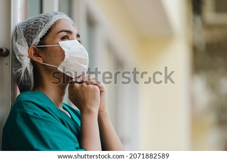 Similar – Image, Stock Photo hard working female doctor, heath care worker with face shield and mask in black and white