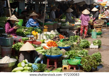 PHU QUOC, VIETNAM - FEB 27: Local farmers selling fresh products at the farmer market on February 27, 2012 in Phu Quoc, Vietnam. This market is held every day and is the biggest on the island.
