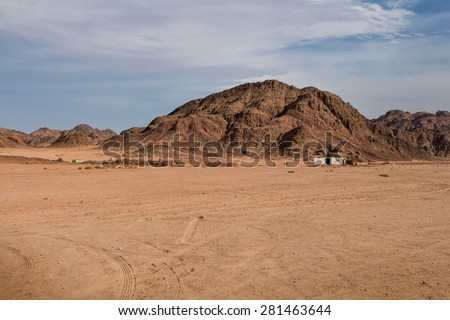 Desert in Egypt Landscape in the desert in Egypt. Rocky hills. Blue sky with many white clouds.