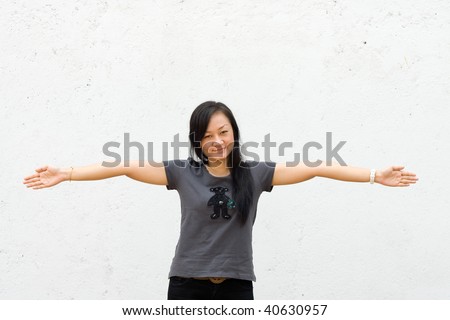 beautiful asian young woman spread her arms wide open