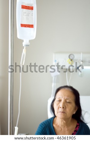 asian old woman get infusion during inpatient treatment at the hospital