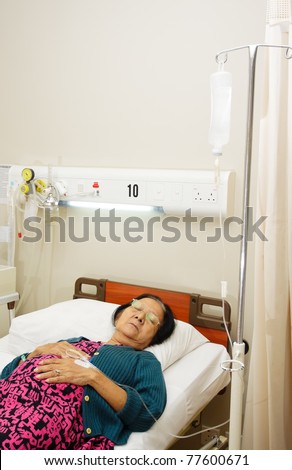 Ill senior patient woman sleep on bed in hospital ward