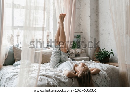 Similar – Image, Stock Photo Dreamy woman raising leg while standing near fence