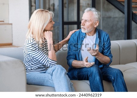 Similar – Image, Stock Photo Woman worried while showing off the window in the city during a spring day, mental health concept