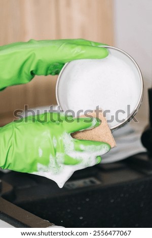 Similar – Image, Stock Photo Washing up bowl filled with the washed outdoor dishes, plates, cups and cutlery put on grass