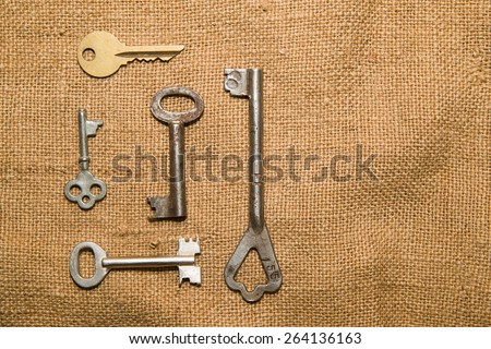 Five vintage keys to the safe on old cloth
