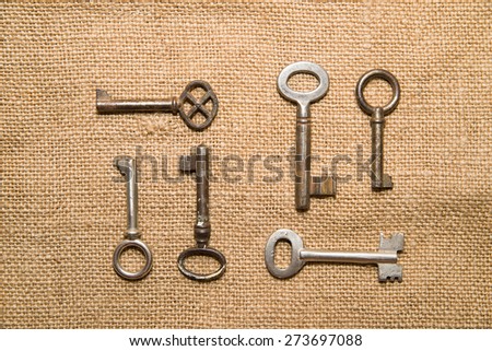 A lot vintage keys to the safe on a  old cloth