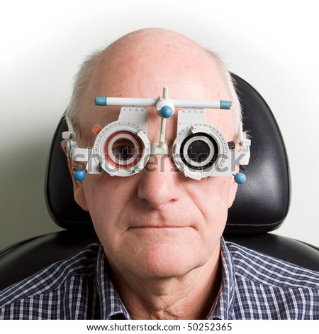 An Older Man Taking An Eye Test Examination At An Opticians Clinic ...