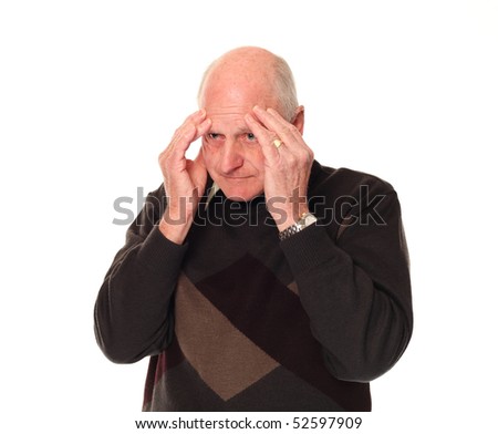 Senior older retired man on white background holding his head with a stress headache