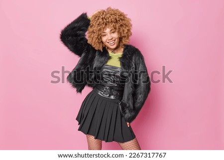 Image, Stock Photo Focused stylish black woman applying eyeliner at home