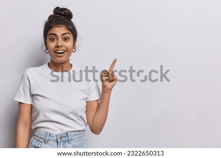 Similar – Image, Stock Photo Photo of surprised cheerful woman with Afro haircut, keeps both hands on cheeks, has natural beauty, opens mouth, cannot believe in exciting news, wears t shirt, poses against white background.