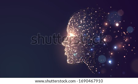 Human face on a dark background of gold glowing particles