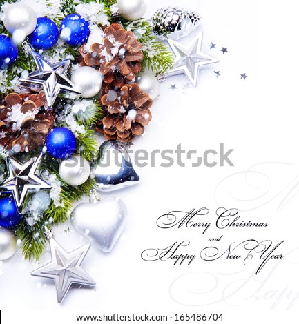 christmas frame with fir tree branch and christmas decoration  on white background