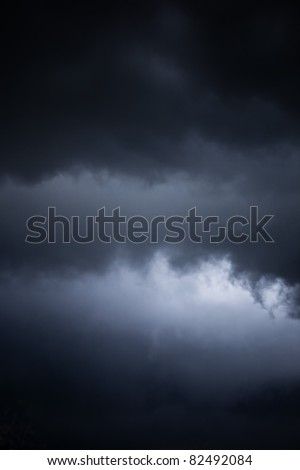 danger of an impending storm, a dark stormy sky