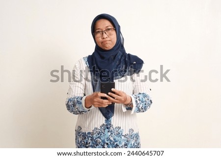 Similar – Image, Stock Photo Anxious elderly woman standing near window during pandemic