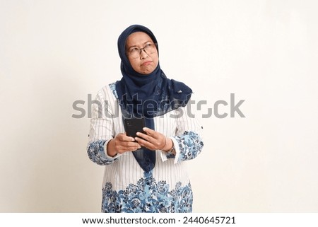 Similar – Image, Stock Photo Anxious elderly woman standing near window during pandemic