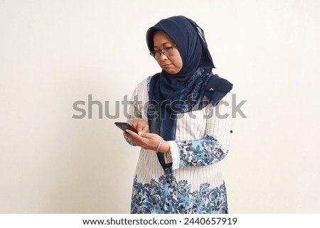 Similar – Image, Stock Photo Anxious elderly woman standing near window during pandemic