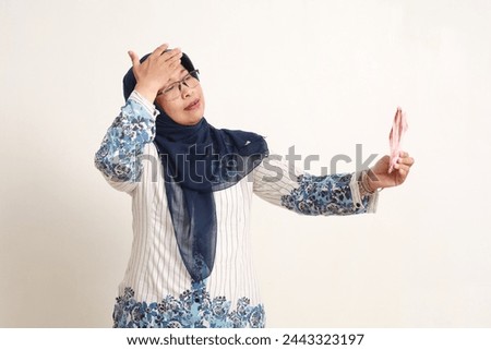 Similar – Image, Stock Photo Anxious elderly woman standing near window during pandemic