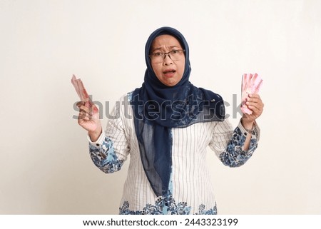 Similar – Image, Stock Photo Anxious elderly woman standing near window during pandemic