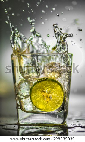 Lemon soda glass in splash