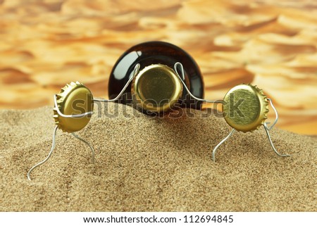 funny cork and bottle on a sandy beach