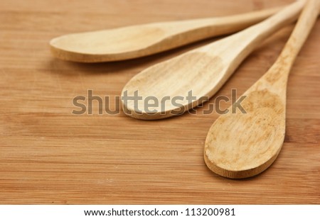 wooden spoon on the kitchen bamboo cutting board